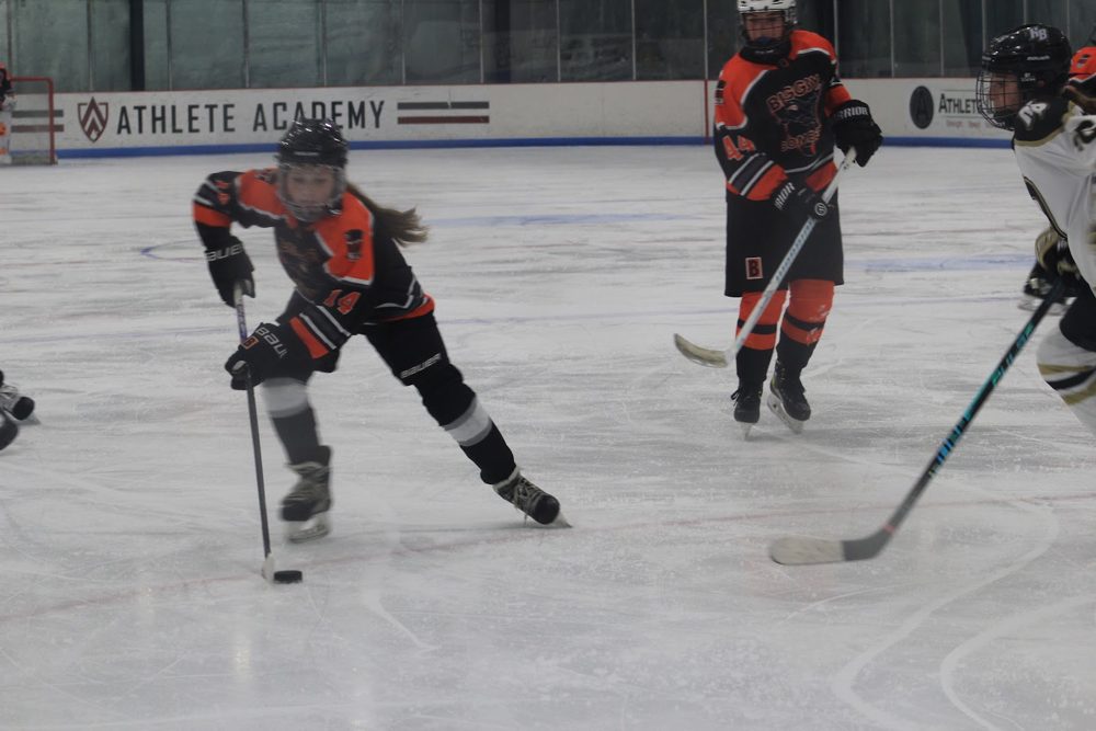 Bomber carries it through the neutral zone.