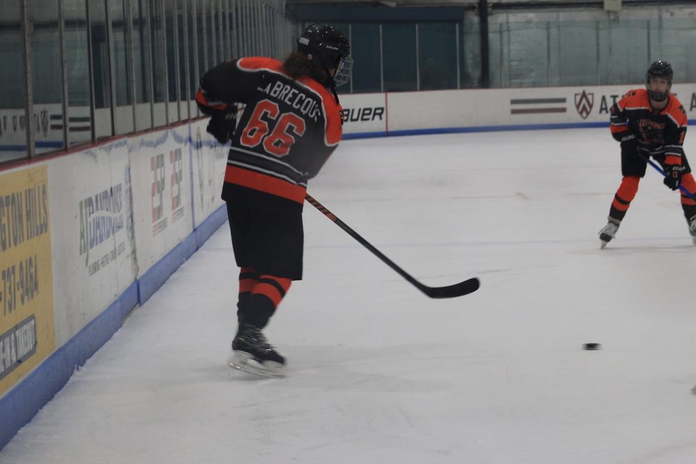 Claire L. (#66) sends one up the boards.