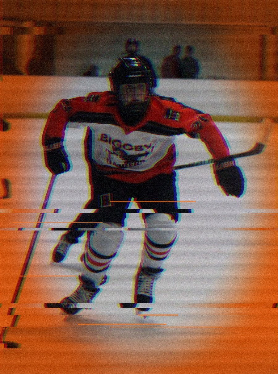 Julia C., number 21, skating up ice against Midland