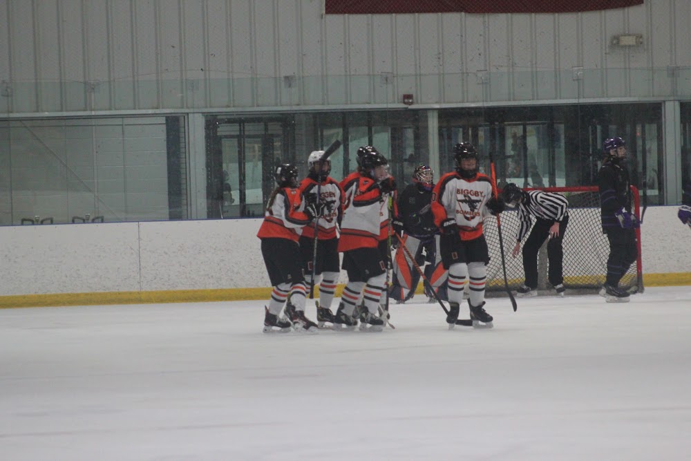 The Biggby crew swarms the Midland crease.