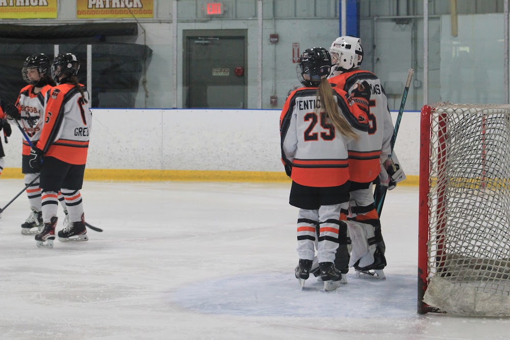 Daria V. (#25) and a teammate holding it down at the Midland net.