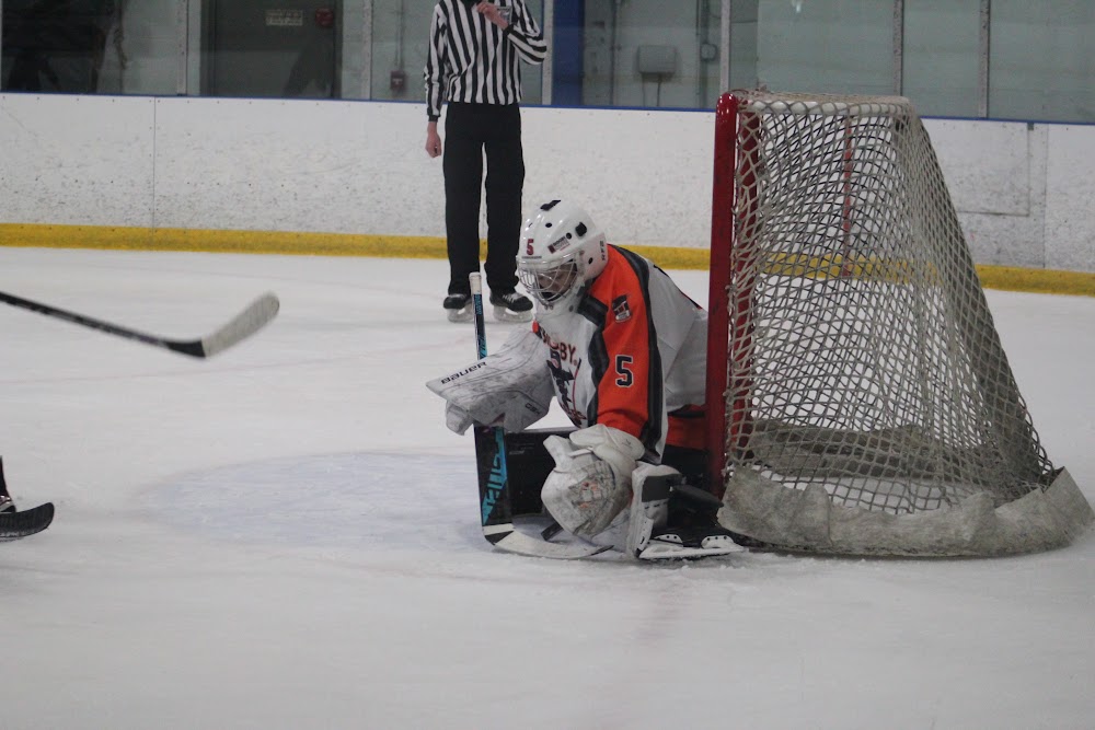 Makayla T. (#5) stonewalling the post.